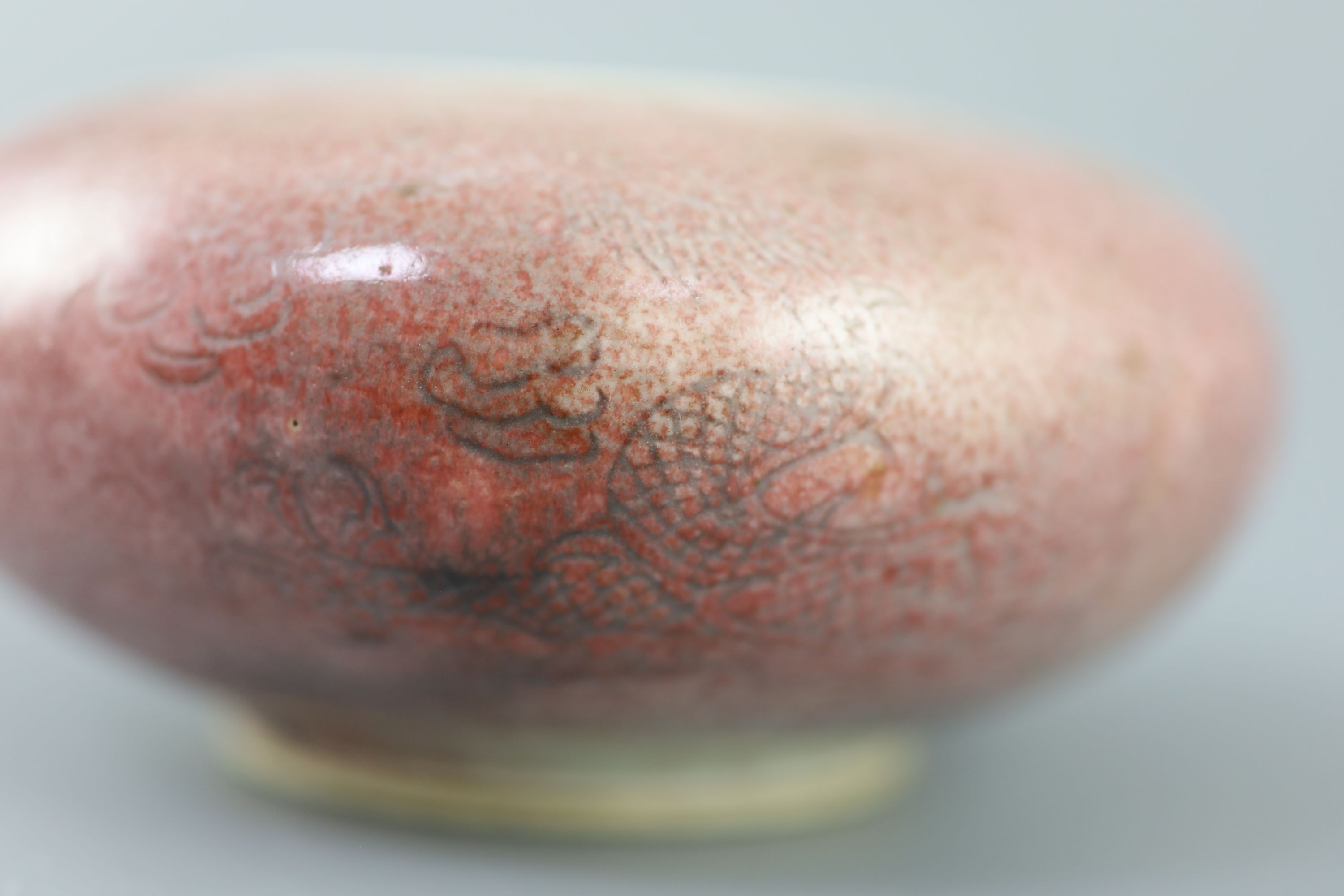 A Chinese peach-bloom dragon water pot, Kangxi six character mark, probably Republic period, 12cm diameter